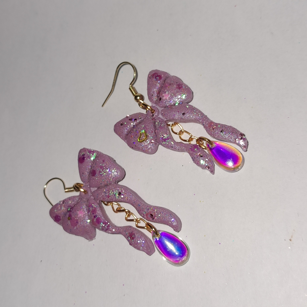 Glittering Pink Bow Earrings with Gold Accents